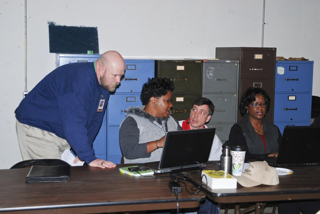 On Tuesday, Jan. 14, members of the Memphis District's Crisis Management Team (CMT) and selected other individuals participated in a half-day Disaster Response Exercise for a New Madrid Seismic Zone Earthquake. The exercise began at 7 a.m. when Alternate Assembly Point leaders traveled to pre-designated locations and used satellite telephones to test communications links with the Alternate Command Post (ACP). The ACP is located at the Central United States Earthquake Consortium facility on Holmes Road south of Memphis International Airport. At 8 a.m. CMT members fully activated the Command Post and conducted additional communication tests. The rest of the morning was given over to working through various potential scenarios and general problem solving. The exercise concluded at noon. (USACE Photo/Brenda Beasley)