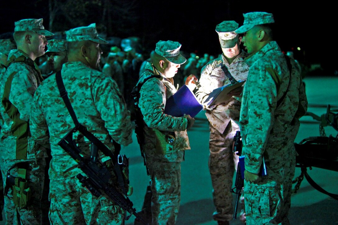 Marines with I Marine Expeditionary Force (Forward), discuss logistics as they prepare to depart Camp Pendleton, Calif., Jan. 13. Nearly 140 of the I MEF (Fwd) command element’s 300 Marines and Sailors said goodbye to family and friends as they departed for Camp Leatherneck and Camp Bastion in Afghanistan.