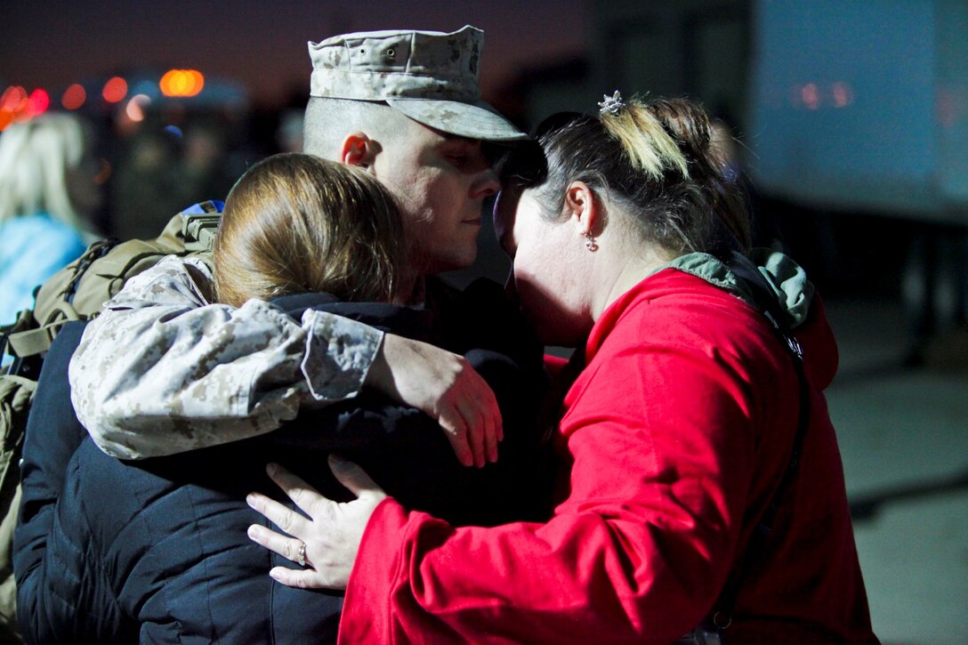 Sgt. Jeremy Speacht, a glasswave operator with I Marine Expeditionary Force (Forward), from Pottsville, Pa., holds his nephew moments before departing Camp Pendleton, Calif., Jan. 13. Nearly 140 of the I MEF (Fwd) command element’s 300 Marines and Sailors said goodbye to family and friends as the departed for Camp Leatherneck and Camp Bastion in Afghanistan.