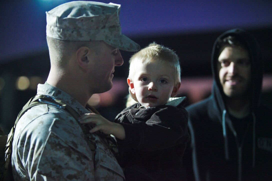 Sgt. Jeremy Speacht, a glasswave operator with I Marine Expeditionary Force (Forward), from Pottsville, Pa., holds his niece moments before departing Camp Pendleton, Calif., Jan. 13. Nearly 140 of the I MEF (Fwd) command element’s 300 Marines and Sailors said goodbye to family and friends as the departed for Camp Leatherneck and Camp Bastion in Afghanistan.