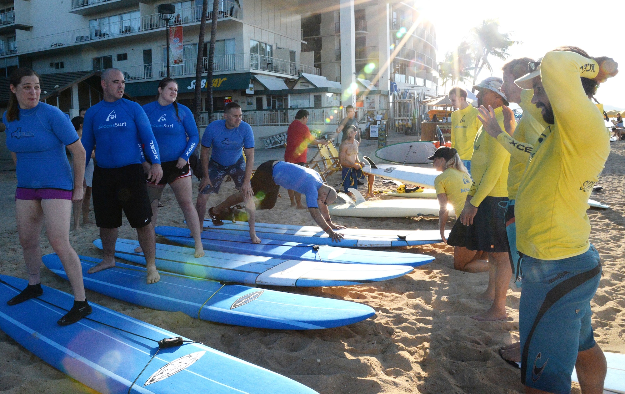 Wounded Warrior participants receive instructions on how to surf during an adaptive surf session at Waikiki Beach in Honolulu, Hawaii, Jan. 11, 2014. The session wrapped up a week of adaptive athletic competitions part of the Wounded Warrior Pacific Invitational. Athletic competitions included cycling, seated volleyball, swimming, track and field and wheelchair basketball. (U.S. Air Force photo/Staff Sgt. Alexander Martinez)