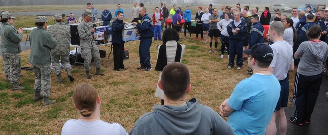 Team Barksdale members gather for a raffle after the New Year's Resolution fun run on Barksdale Air Force Base, La., Jan. 10, 2014. Prizes were donated from various community sponsors in an effort to show support for Barksdale Airmen and their families. (U.S. Air Force photo/Senior Airman Kristin High) 