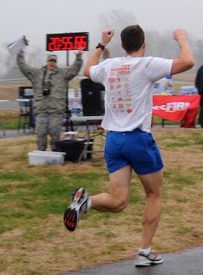 Maj. Walter Carroll, 2nd Bomb Wing commander's action group, wins the New Year's Resolution 5K fun run on Barksdale Air Force Base, La., Jan. 10, 2014. His official time for the more than three-mile run was 20 minutes and 54 seconds. (U.S. Air Force photo/Senior Airman Kristin High)