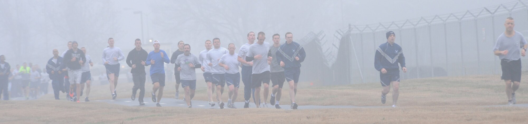 Team Barksdale members drudged through the fog and damp weather during the New Year's Resolution fun run on Barksdale Air Force Base, La., Jan. 10, 2014. The fun run was held to mark the beginning of a New Year, New You initiative between the Health and Wellness Center and the Bryan R. Bell Fitness Center. (U.S. Air Force photo/Senior Airman Kristin High)