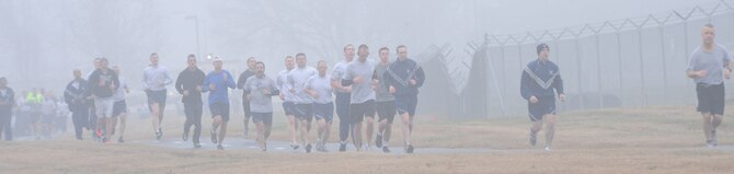 Team Barksdale members drudged through the fog and damp weather during the New Year's Resolution fun run on Barksdale Air Force Base, La., Jan. 10, 2014. The fun run was held to mark the beginning of a New Year, New You initiative between the Health and Wellness Center and the Bryan R. Bell Fitness Center. (U.S. Air Force photo/Senior Airman Kristin High)