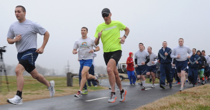 Team Barksdale members take off during the New Year's Resolution 5K fun run on Barksdale Air Force Base, La., Jan. 10, 2014. The fun run was hosted by the Bryan R. Bell Fitness Center, who is teaming up the Health and Wellness Center to welcome Team Barksdale to a New Year, New You. (U.S. Air Force photo/Senior Airman Kristin High)