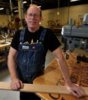 Kevin Watt, 92nd Force Support Squadron woodcraft instructor, poses for a photo in the wood craft center at Fairchild Air Force Base, Wash., Jan. 13, 2014. Watt has recently taken on the role as the wood shop instructor. (U.S. Air Force photo by Airman 1st Class Ryan Zeski/Released)