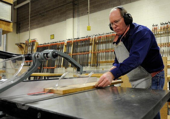 Kevin Watt, 92nd Force Support Squadron woodcraft instructor, uses the table saw in the wood craft center at Fairchild Air Force Base, Wash., Jan. 10, 2014. Watt has recently taken on the role of the new wood craft instructor. (U.S. Air Force photo by Airman 1st Class Ryan Zeski/Released)