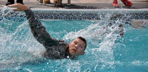 Members of Joint Task Force-Bravo participate in a 100 meter swim while in uniform during testing for the German Armed Forces Proficiency Badge at Soto Cano Air Base, Honduras, Jan. 14, 2014.  Several members of Joint Task Force-Bravo are attempting to qualify for the German Armed Forces Proficiency Badge this week. In order to qualify for the badge, service members must pass both a fitness test and a military training test, administered by a German Sergeant Major. Today, JTF-Bravo members completed an 11x10 meter spring test, a chin-up (flexed arm hang) test, a 1,000 meter run and a 100 meter swim in uniform. The German Armed Forces Proficiency Badge (German: Abzeichen für Leistungen im Truppendienst) is a decoration of the Bundeswehr, the Armed Forces of the Federal Republic of Germany. The decoration can be awarded to all German Soldiers. Allied Soldiers may also be awarded the badge. Any rank may be awarded and wear the badge. In the United States Military the German Armed Forces Proficiency Badge is one of the few approved foreign awards, and it is one of the most sought after awards to achieve. (U.S. Air Force photo by Capt. Zach Anderson)