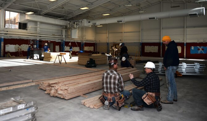Muth Electric Inc. and GBK Joint Venture employees work on renovating the Bellamy Fitness Center at Ellsworth Air Force Base, S.D., Jan. 6, 2014. Renovations made to the facility’s infrastructure will ensure the safety of Ellsworth Airmen. (U.S. Air Force photo by Airman 1st Class Rebecca Imwalle/ Released)