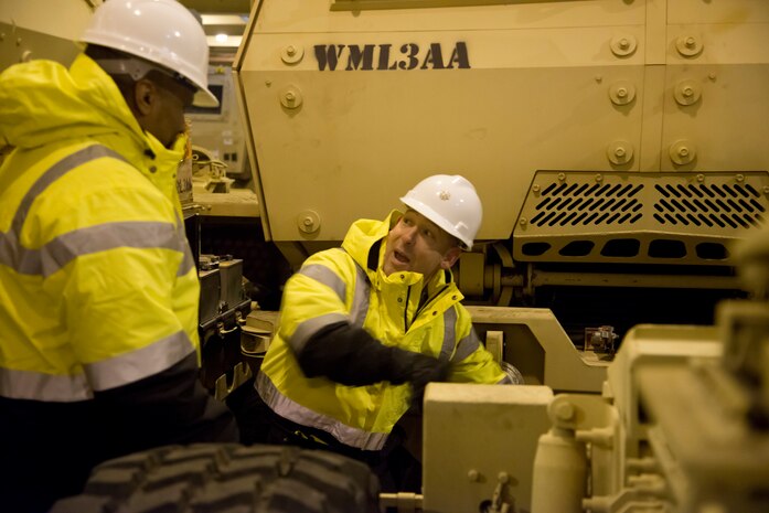 Lt. Col. Bryan Memoli,  841st Transportation Battalion commander, shows Col. Jason Vick, 597th Transportation Brigade commander around the hull of the USNS Pomeroy  (T-AKR-316), during his visit Jan. 7, 2014 at Joint Base Charleston – Weapons Station. Vick was in Charleston to visit the 841st Transporation Battalion.The Pomeroy has seven decks capable of carrying up to nearly 400,000 square feet of cargo. The 841st Transportation Battalion is responsible for all Department of Defense cargo on commercial vessels along the Atlantic coast from the port of Savannah, Ga. to Maine. (U.S. Air Force photo/Staff Sgt. William O’Brien)