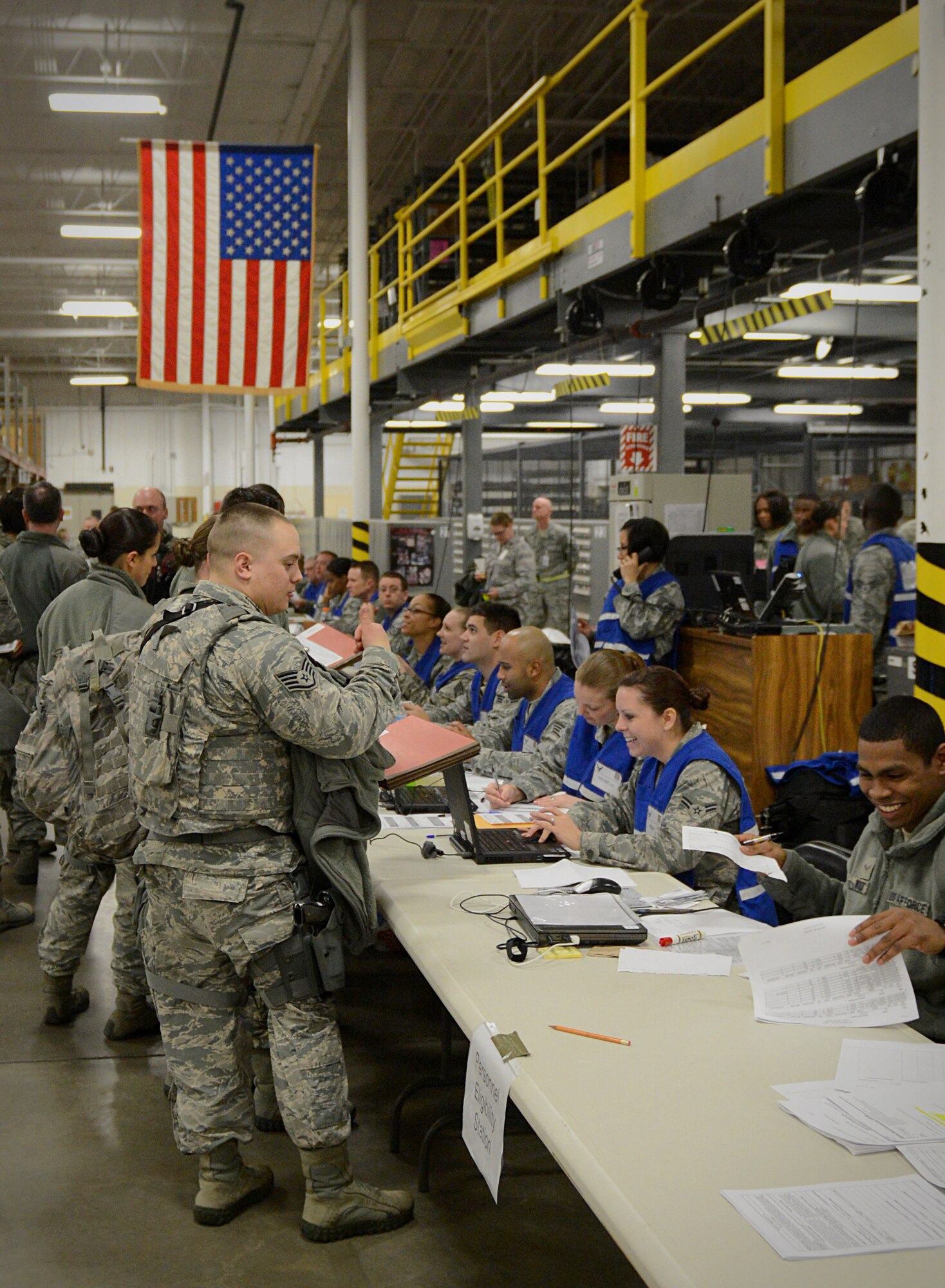 Members participating in the exercise get their files checked to ensure they have all required paperwork for their deployment   Jan. 10, 2014 at Scott Air Force Base, Ill. The exercise provided an opportunity for the 375th Air Mobility Wing to test capabilities and procedures while ensuring Airmen maintain readiness to support Department of Defense operations. (U.S. Air Force photo/Senior Airman Jake Eckhardt)