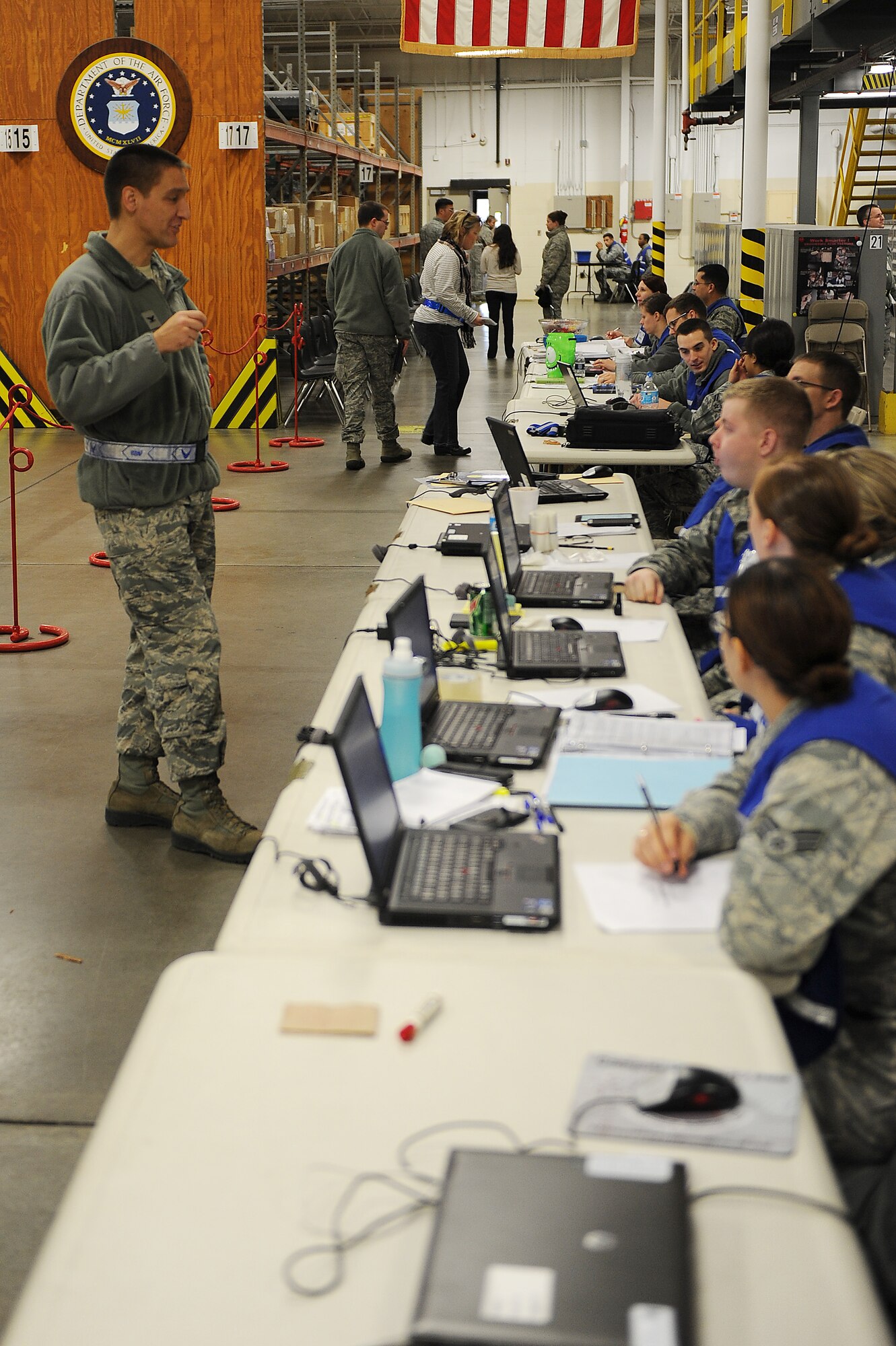 Col. Kyle Kremer speaks with members of Team Scott during a Mobility Exercise Jan. 11, 2014, Scott Air Force Base, Ill.  The three-day exercise evaluated the 375th Air Mobility Wing's ability to process personnel and cargo for contingencies.  Kremer is the commander of the 375th Air Mobility Wing. (U.S. Air Force photo/Senior Airman Divine Cox)