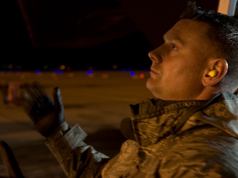 U.S. Air Force Staff Sgt. Justin Grover, 7th Aircraft Maintenance Squadron, directs a jammer to the proper location underneath a Joint Air-to-Surface Standoff Missile-Extended Range Dec. 12, 2013, at Dyess Air Force Base, Texas. Currently the JASSM-ER (AGM-158B) is only compatible with the B-1B Lancer, while the JASSM (AGM-158A) is functional on four additional airframes, including both fighters and bombers. The B-1’s ability to fly faster, further and with the largest weapons payload in the Air Force, made it the ideal aircraft to test the extended range missile. (U.S. Air Force photo by Senior Airman Peter Thompson/Released)