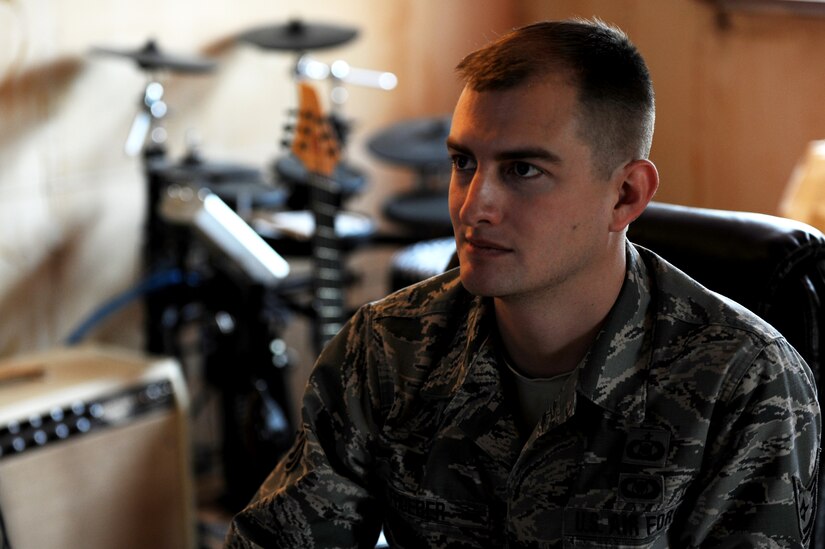 U.S. Air Force Reserve Tech. Sgt. Stephen Froeber, 710th Combat Operations Squadron control and warning systems manager, works on a symphony at his home studio in Hampton, Va., Jan. 10, 2014. As a freelance composer, Frober has written music for various genres, including games and feature films. (U.S. Air Force photo by Staff Sgt. Jarad A. Denton/Released)