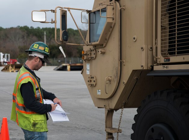 Seth Yarborough, International Longshoreman Association checker, logs in a Mine-Resistant Ambush Protected vehicle before it proceeds to the  Army Strategic Logistics Activity Charleston, Jan. 10, 2014, at the Joint Base Charleston – Weapons Station, S.C.  (U.S. Air Force photo/Senior Airman Ashlee Galloway)