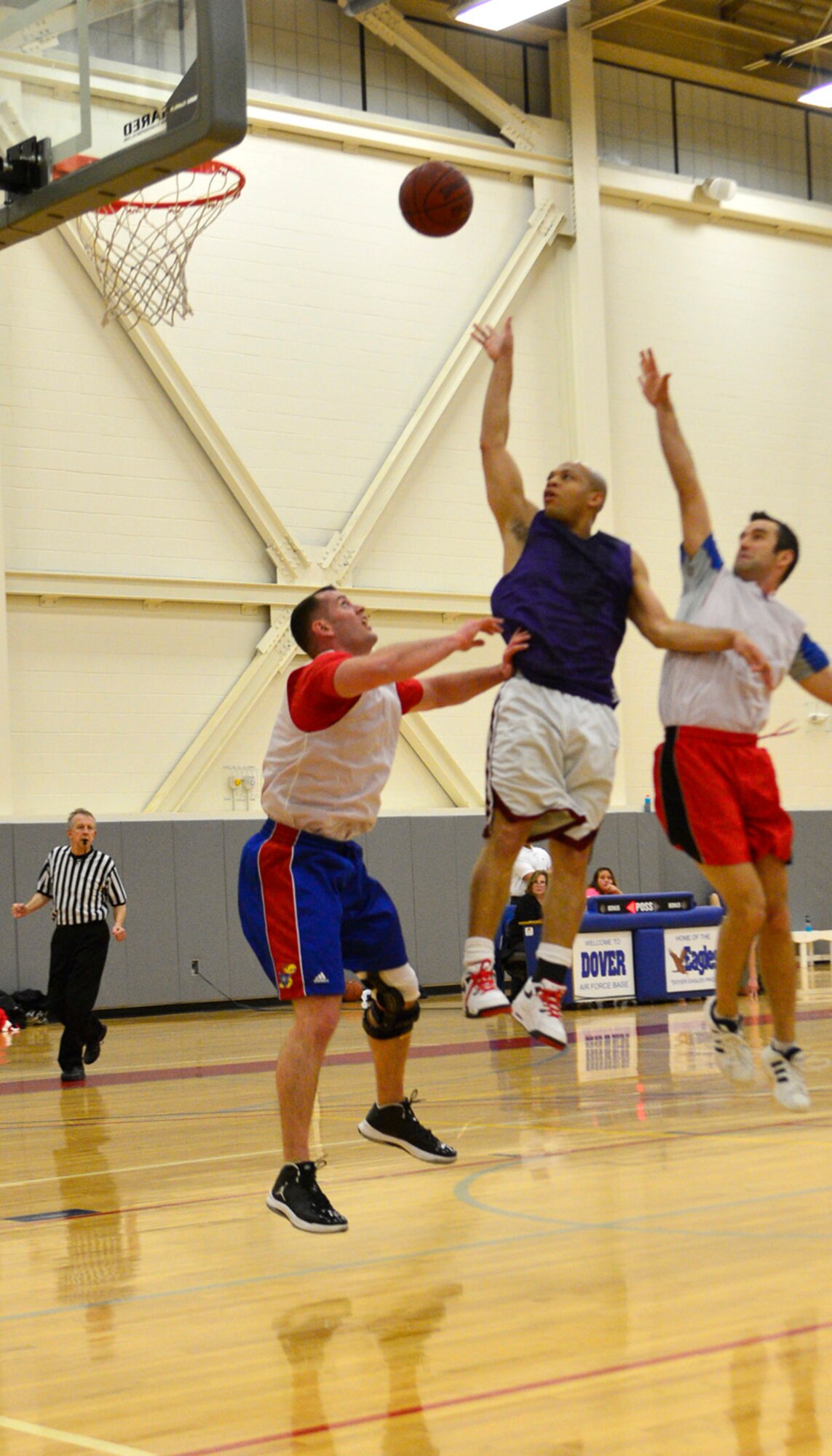 Antwan Piper, 436th Medical Group guard, goes up for a shot during their opening game against the 9th Airlift Squadron in intramural basketball Jan. 13, 2014, at Dover Air Force Base, Del. The 436th MDG pulled off a huge victory over the 9th AS. (U.S. Air Force photo/Airman 1st Class William Johnson)