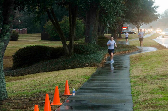 2nd Lt. Alexandra Trobe, 628th Public Affairs chief of internal, approaches the finish line during the Commander's Challenge Jan. 10, 2014, at Joint Base Charleston - Air Base, S.C. Trobe finished with a time of 20 minutes, 45 seconds. The Commander's Challenge is held monthly to test Team Charleston's fitness abilities. (U.S. Air Force photo / Staff Sgt. Aaron Thomasson)
