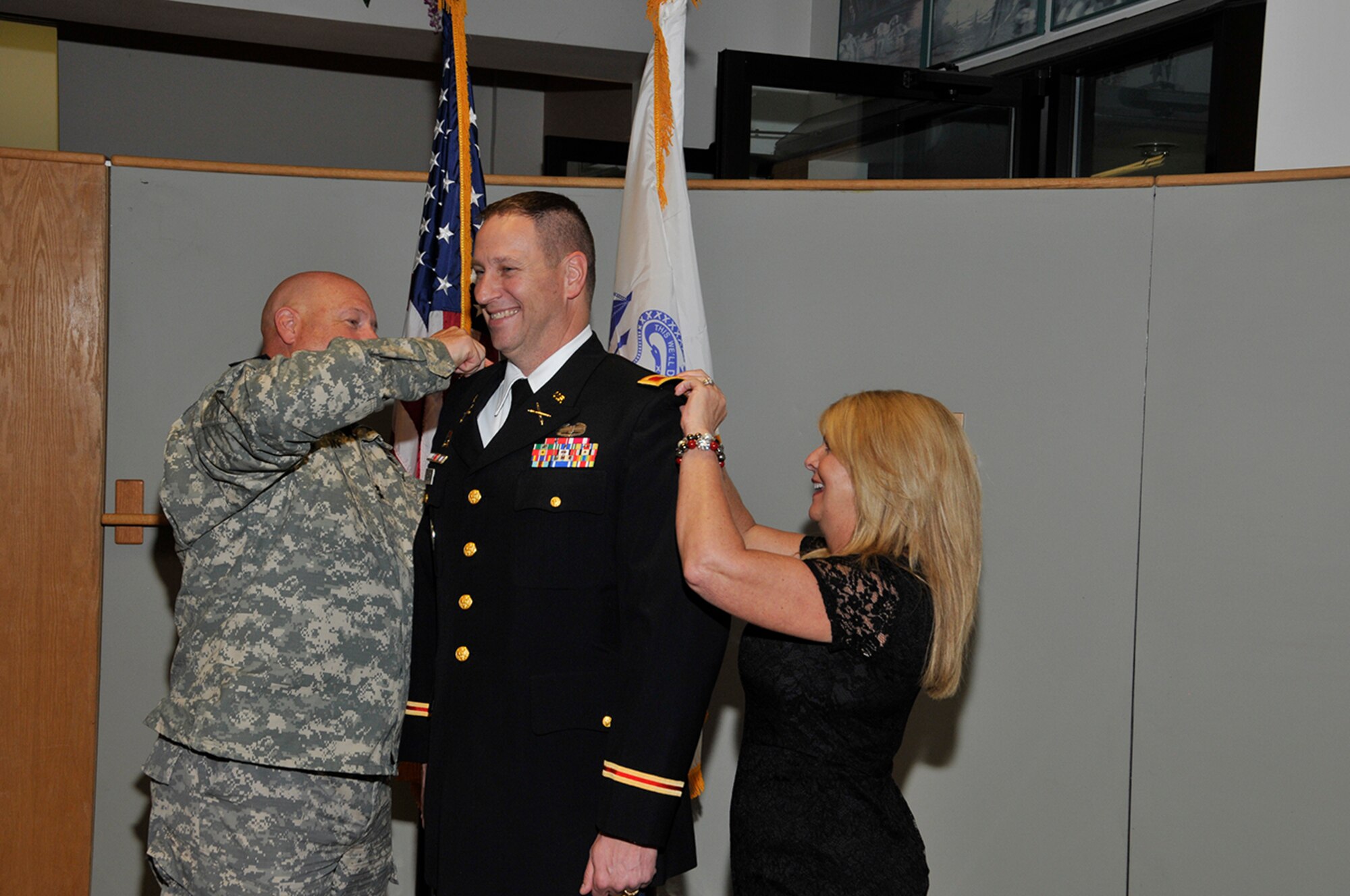 Aerospace Testing Alliance (ATA) Mission Support Deputy Branch Manager Warner Holt (center) was recently promoted to colonel in the U.S. Army. Shown here assisting with his pinning and promotion ceremony is Maj. Gen. Max Haston (left), the Adjutant General of Tennessee, and Holt’s wife Nancy. (Photo by Rick Goodfriend)