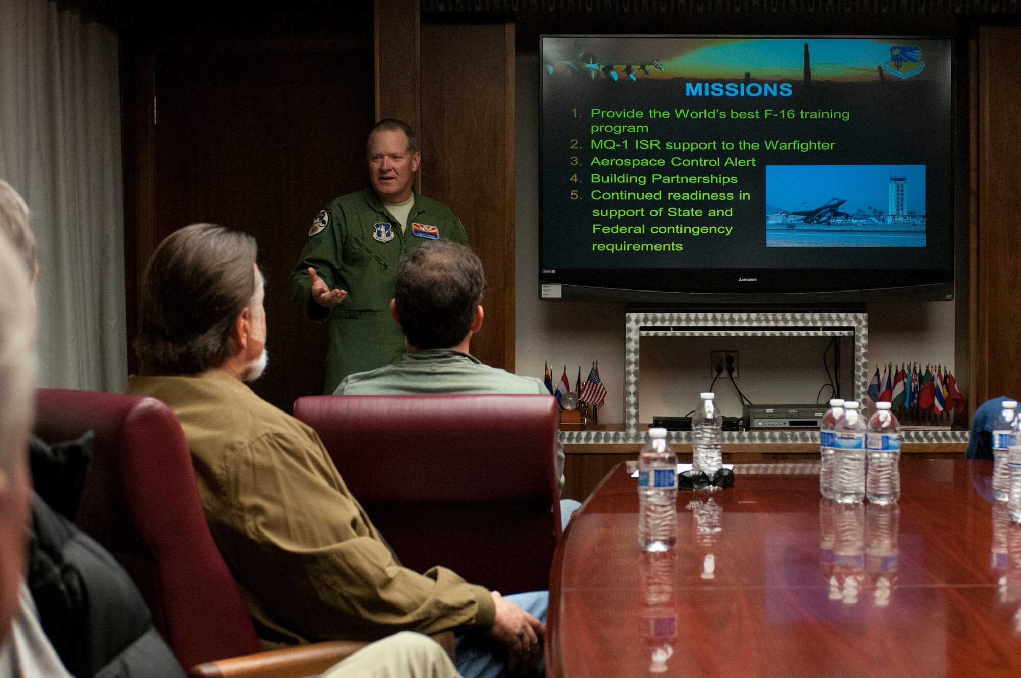 Lt. Col. Rosson, the 162nd Fighter Wing Vice Commander, explains the unit missions to members of the Air Guardians during a base tour Jan. 11. (U.S. Air National Guard photo by Tech. Sgt. Hollie Hansen/Released)
