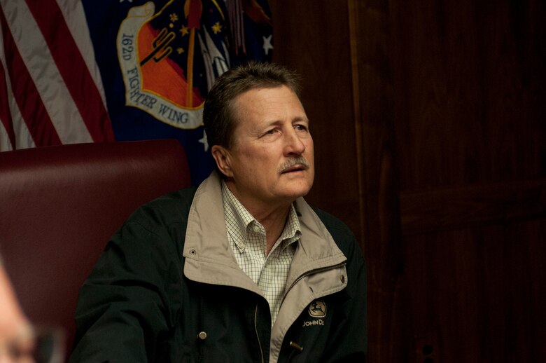 Brian Andrews, President of the Air Guardians, listens to a briefing given by Lt. Col. Rosson discussing the 162nd mission during a base tour for the Air Guardians Jan. 11. (U.S. Air National Guard photo by Tech. Sgt. Hollie Hansen/Released)

 
