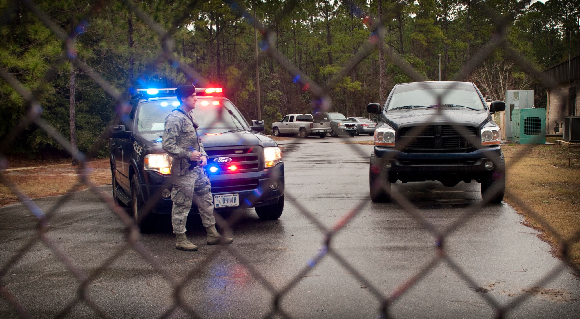 A 1st Special Operations Security Forces Squadron patrolman stands guard outside the Explosive Ordnance Disposal building on Hurlburt Field, Fla., Jan. 13, 2014. The active shooter training prepared SFS Airmen for real-world incidents. (U.S. Air Force photo/Senior Airman Krystal M. Garrett) 