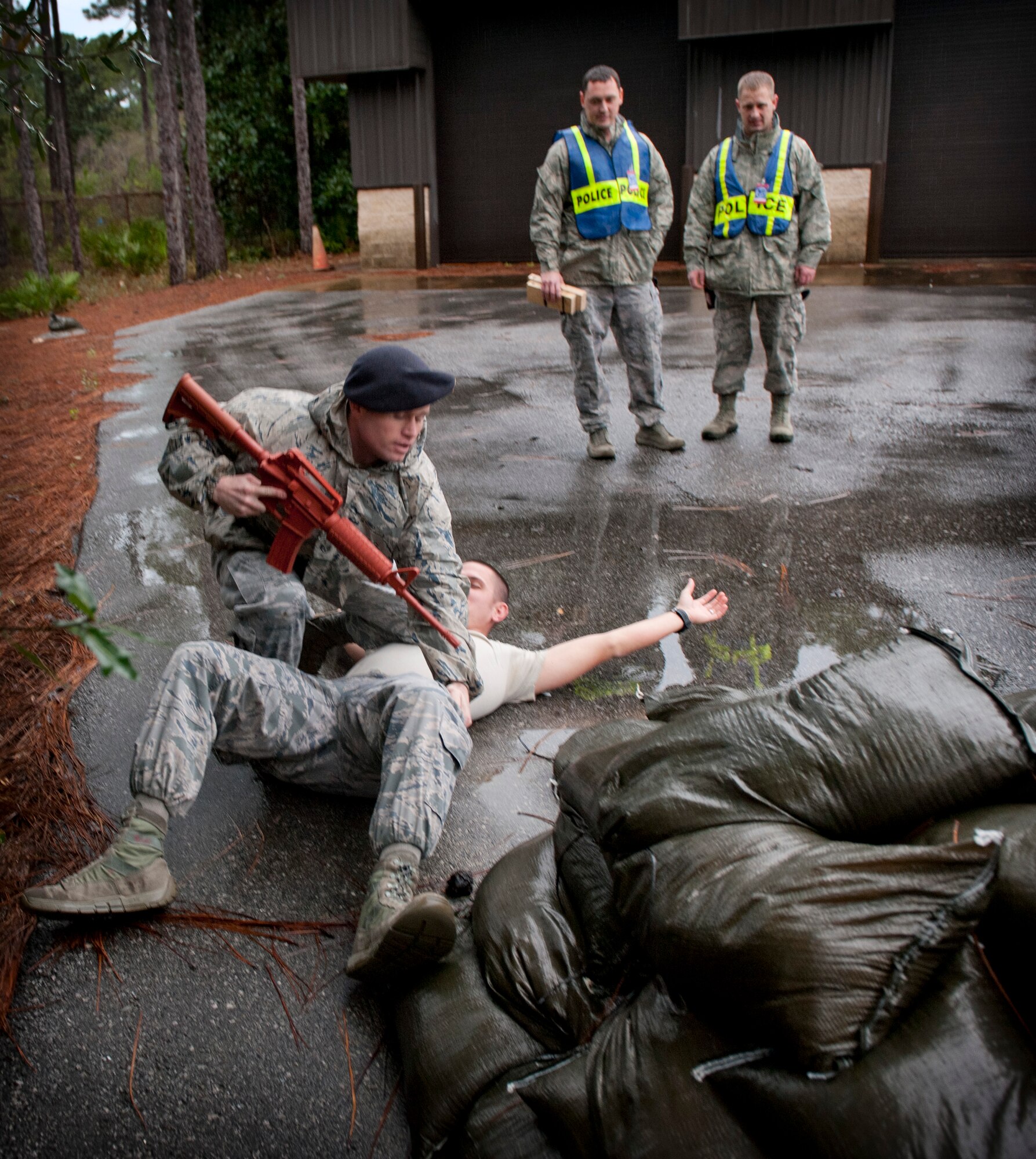 A 1st Special Operations Security Forces Squadron patrolman apprehends a suspect during an active shooter exercise at the Explosive Ordnance Disposal building on Hurlburt Field, Fla., Jan. 13, 2014. The active shooter training prepared SFS Airmen for real-world incidents. (U.S. Air Force photo/Senior Airman Krystal M. Garrett) 