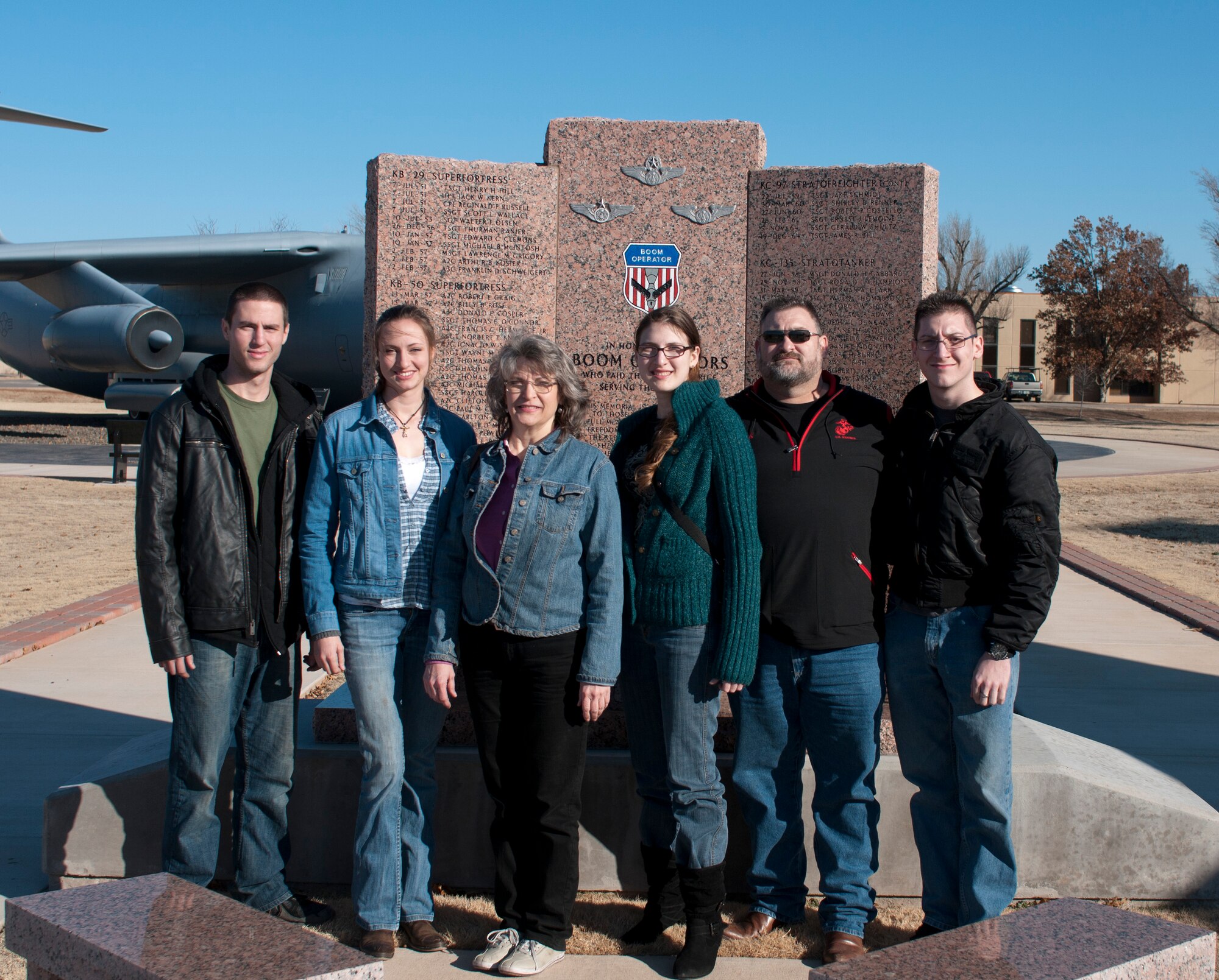 ALTUS AIR FORCE BASE, Okla. – The Tardie family stands in front of the boom operator memorial in Wings of Freedom Park, Jan. 10, 2014. U.S. Air Force Staff Sgt. Jimmy Tardie died in 1965 when his KC-135 Stratotanker refueler crashed in Maine. His name is engraved on the memorial. (U.S. Air Force photo by Staff Sgt. Nathanael Callon/Released) 