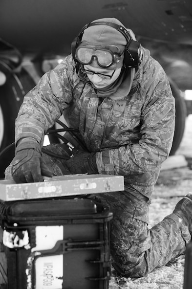 Maintenance Airmen, crew chiefs and flight crews work together in frigid weather conditions to ensure the successful launch of their B-52H Stratofortresses at Minot Air Force Base, N.D. Jan. 7. Crew chiefs and maintenance Airmen work long hours in a difficult and austere environment to meet the demands of their mission. Strong communication skills, job knowledge and working with a tight nit team helps to guarantee their success. (U.S. Air Force photos/Senior Airman Stephanie Sauberan and Airman 1st Class Andrew Crawford)