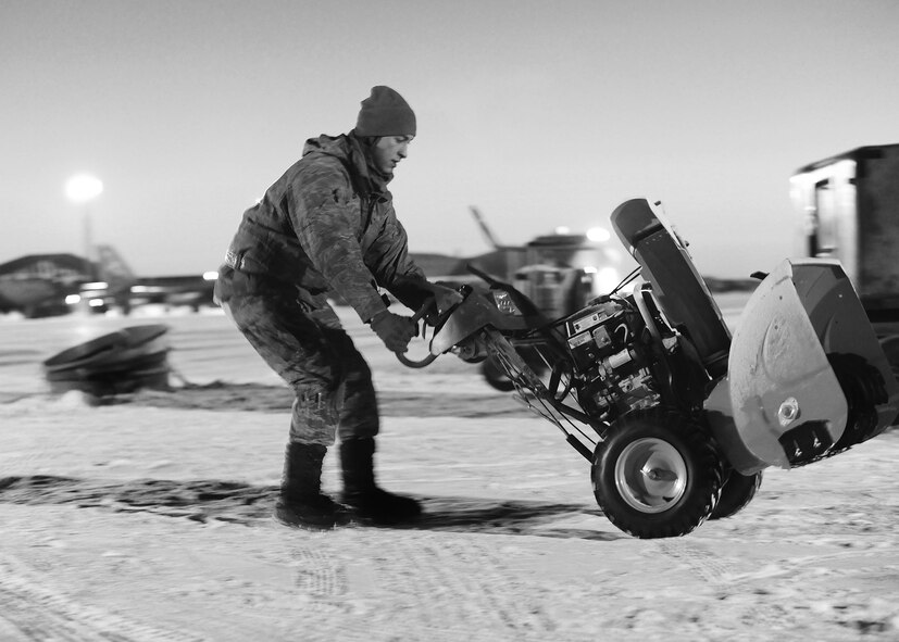 Maintenance Airmen, crew chiefs and flight crews work together in frigid weather conditions to ensure the successful launch of their B-52H Stratofortresses at Minot Air Force Base, N.D. Jan. 7. Crew chiefs and maintenance Airmen work long hours in a difficult and austere environment to meet the demands of their mission. Strong communication skills, job knowledge and working with a tight nit team helps to guarantee their success. (U.S. Air Force photos/Senior Airman Stephanie Sauberan and Airman 1st Class Andrew Crawford)