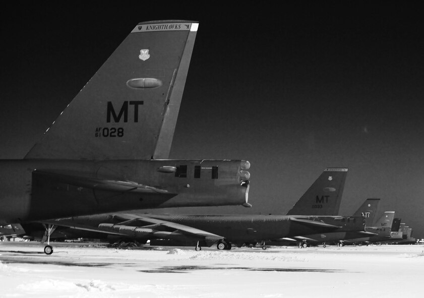Maintenance Airmen, crew chiefs and flight crews work together in frigid weather conditions to ensure the successful launch of their B-52H Stratofortresses at Minot Air Force Base, N.D. Jan. 7. Crew chiefs and maintenance Airmen work long hours in a difficult and austere environment to meet the demands of their mission. Strong communication skills, job knowledge and working with a tight nit team helps to guarantee their success. (U.S. Air Force photos/Senior Airman Stephanie Sauberan and Airman 1st Class Andrew Crawford)