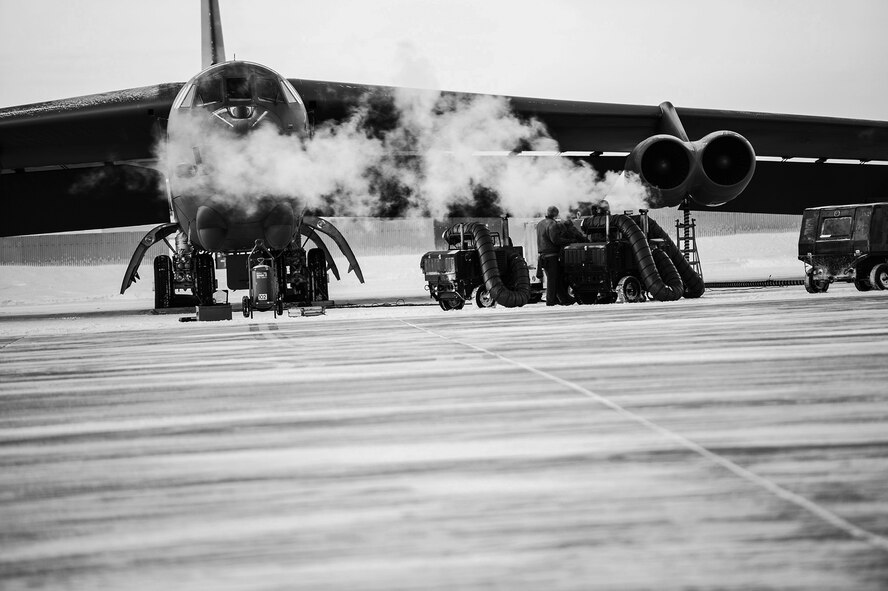 Maintenance Airmen, crew chiefs and flight crews work together in frigid weather conditions to ensure the successful launch of their B-52H Stratofortresses at Minot Air Force Base, N.D. Jan. 7. Crew chiefs and maintenance Airmen work long hours in a difficult and austere environment to meet the demands of their mission. Strong communication skills, job knowledge and working with a tight nit team helps to guarantee their success. (U.S. Air Force photos/Senior Airman Stephanie Sauberan and Airman 1st Class Andrew Crawford)