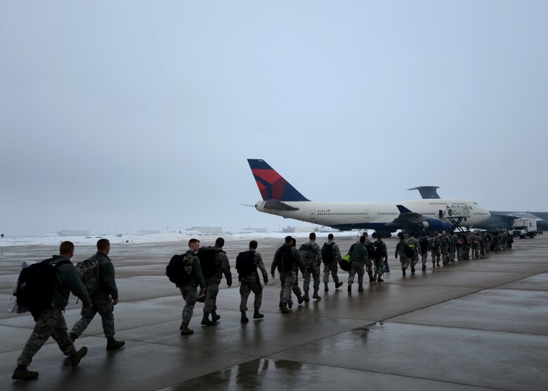 Nearly 300 Airmen from Hill's active duty 388th Fighter Wing and Air Force Reserve 419th FW board a Boeing 747 en route to the Republic of Korea as part of a joint deployment to provide stability and security in the Asia-Pacific region. (U.S. Air Force photo by Senior Airman Justyn Freeman)
