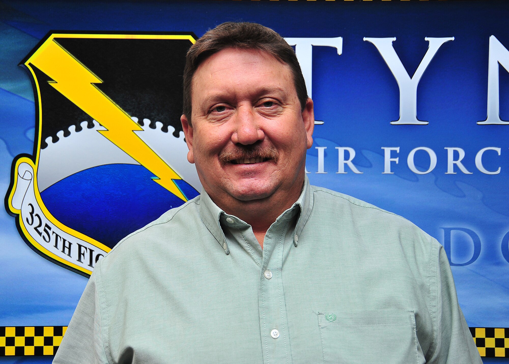 Michael Simons, 325th Fighter Wing flight safety manager, poses for a picture Jan. 8, at the 325th FW conference room. Simons received the 9th Air Force Career Professional of the Year Award. (U.S. Air Force photo by Airman 1st Class Sergio A. Gamboa)