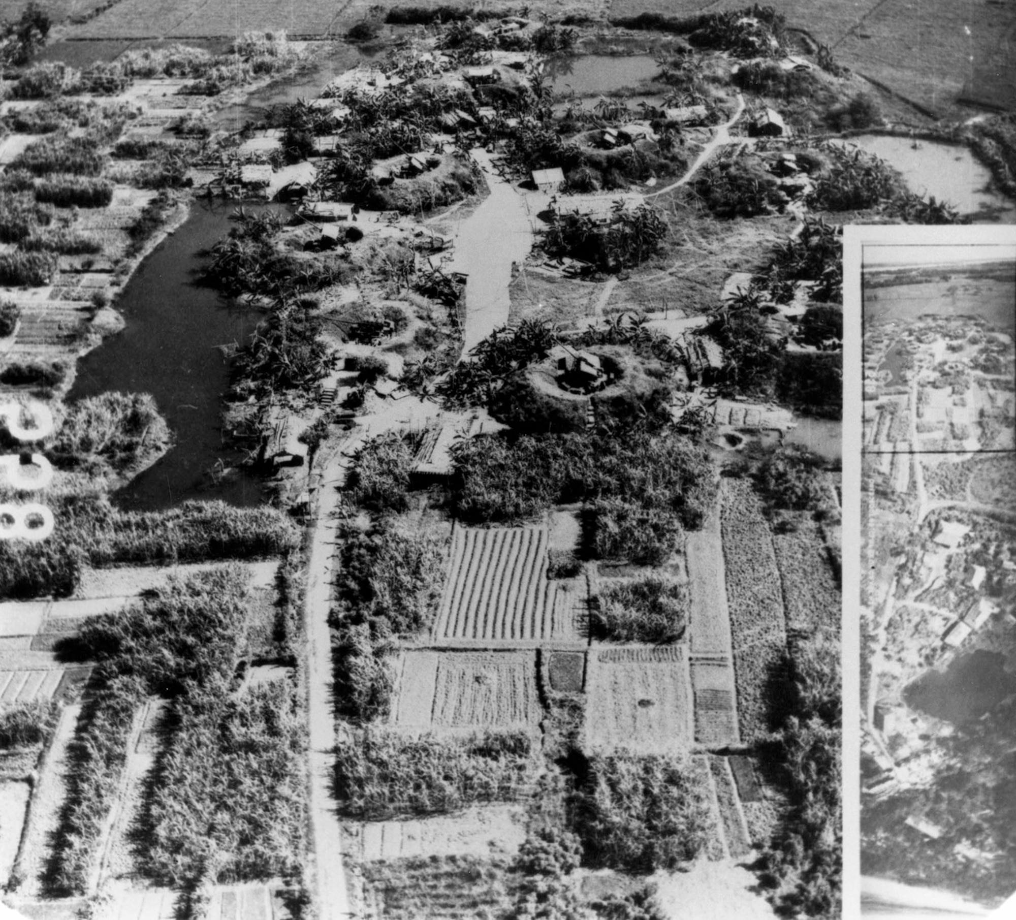 Photos of a communist anti-aircraft battery taken at low altitude by a Firebee. The seven gun positions are marked with arrows. The inset photo was shot with the Firebee’s panoramic camera. (U.S. Air Force photo)