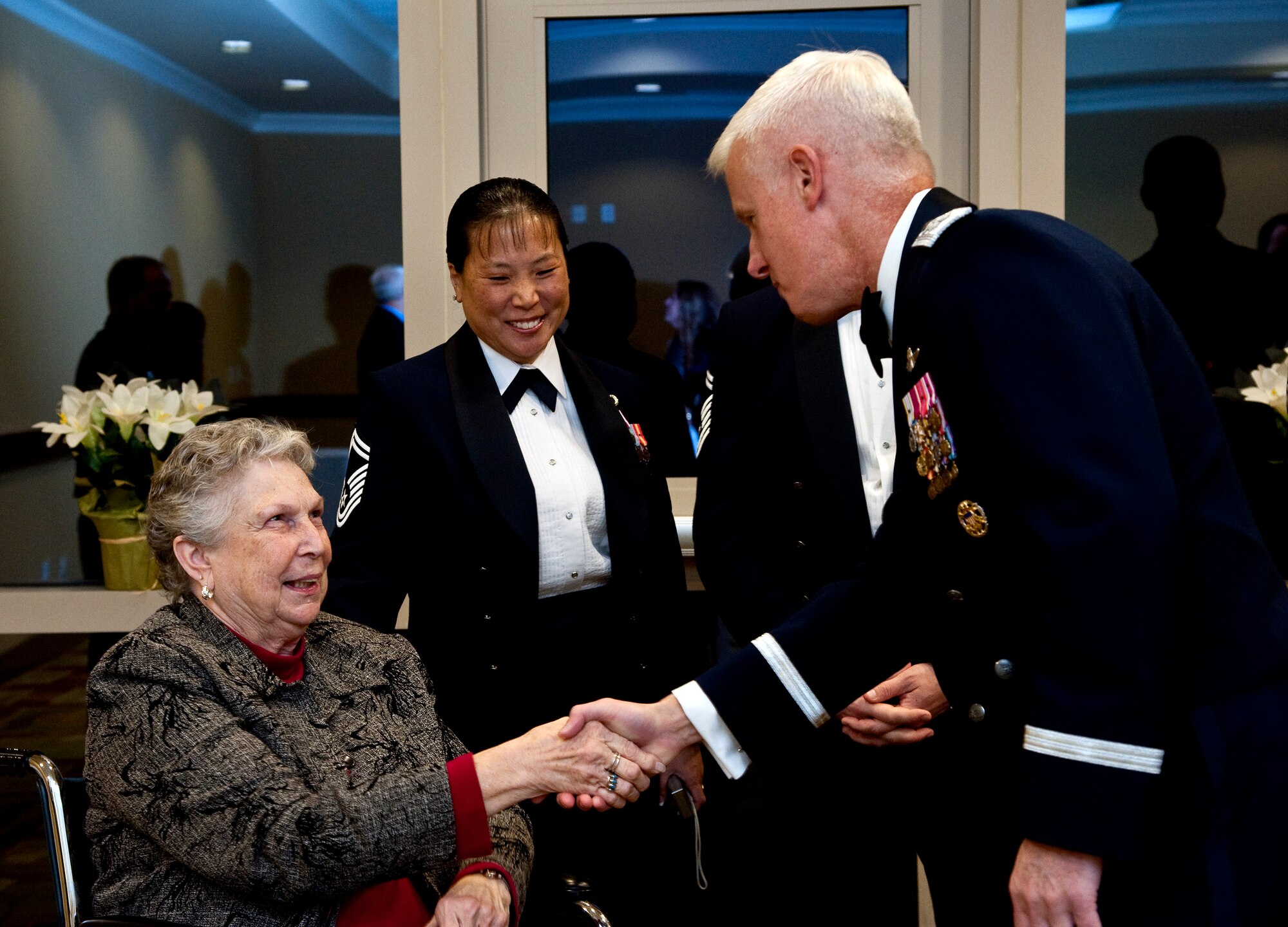 Maj. Gen. Norman Brozenick, Air Force Special Operations Command vice commander, welcomes a guest during the chief master sergeant induction ceremony at the Soundside Club on Hurlburt Field, Fla., Jan. 10, 2014. Brozenick presented medallions to the inductees during the ceremony. (U.S. Air Force photo/Senior Airman Michelle Vickers)