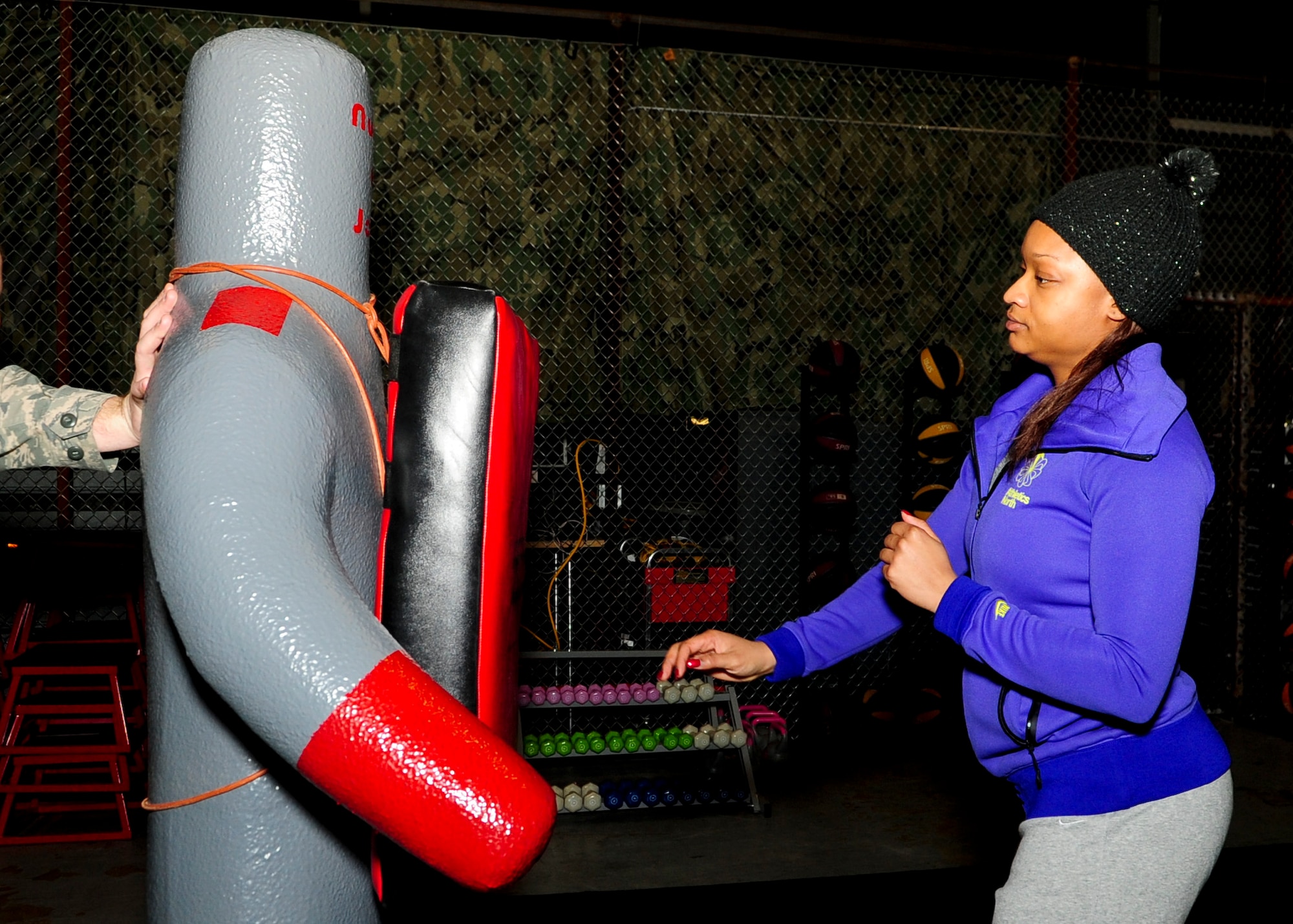 Staff Sgt. Evelyn Neal, 436th Maintenance Group data analyst, practices an open palm strike on a dummy Dec. 16, 2013, at Dover Air Force Base, Del. Neal took a self-defense class hosted by the Ravens. (U.S. Air Force photo/Airman 1st Class Ashlin Federick)