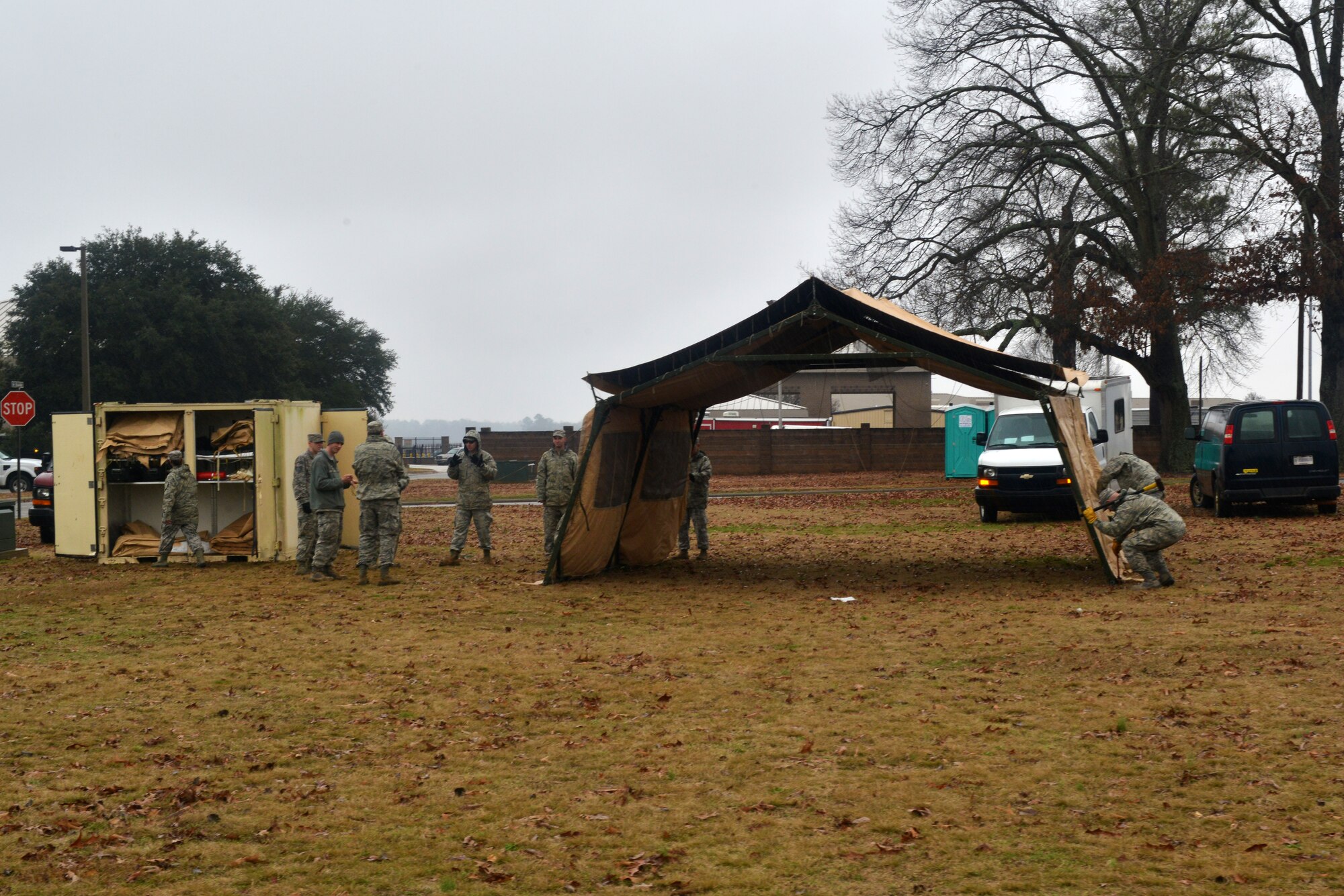 U.S. Air Force Airmen from the 20th Civil Engineer Squadron, set up a TEMPER tent at Shaw Air Force Base, S.C., Jan. 10, 2014. The Airmen set up the tent to be used as a simulated chemical containment area for an operational readiness exercise. (U.S. Air Force photo by Airman 1st Class Jensen Stidham/Released)