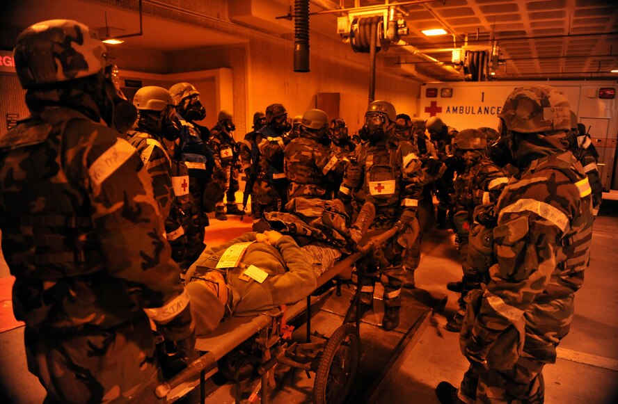 Members of the 51st Medical Group prepare to transport a simulated chemical attack victim into the hospital during Operational Readiness Exercise Beverly Midnight 14-01 at Osan Air Base, Republic of Korea, Jan. 13, 2014. During exercises like BM 14-01, first responders are tested on their ability to provide care during a multitude of scenarios including chemical and ground attacks. (U.S. Air Force photo/Senior Airman Siuta B. Ika)