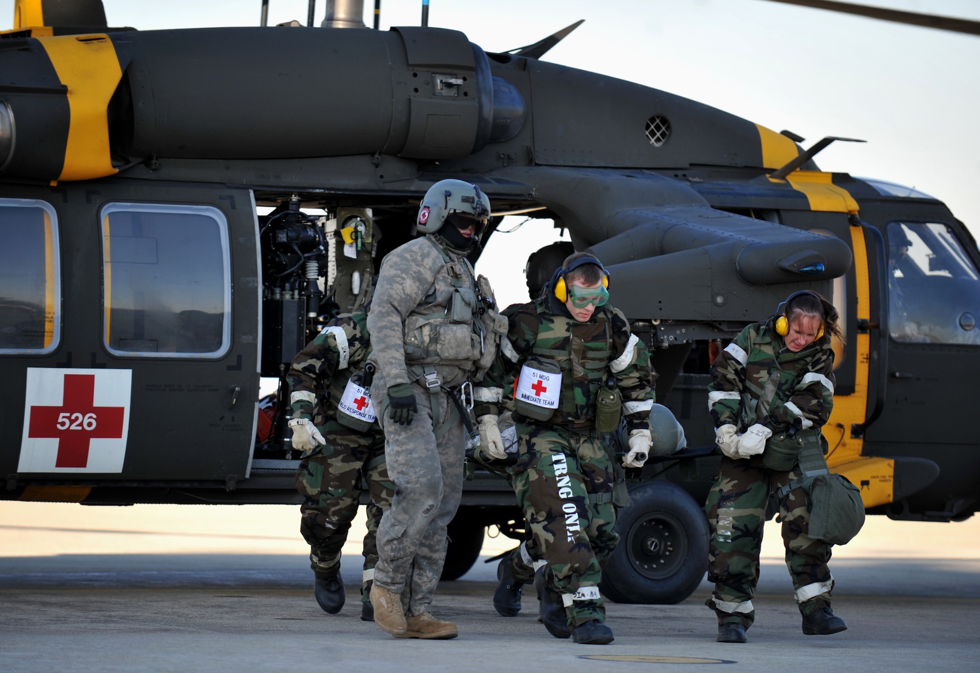 Personnel from the 51st Medical Group meet a simulated medical evacuation casualty during Operational Readiness Exercise Beverly Midnight 14-01 at Osan Air Base, Republic of Korea, Jan. 13, 2014. The scenario exercised the Airmen’s capability to receive casualties from other bases on the Korean peninsula – in this case the patient was simulated as incoming from U.S. Army Garrison Humphries, ROK. (U.S. Air Force photo/Senior Airman Siuta B. Ika)