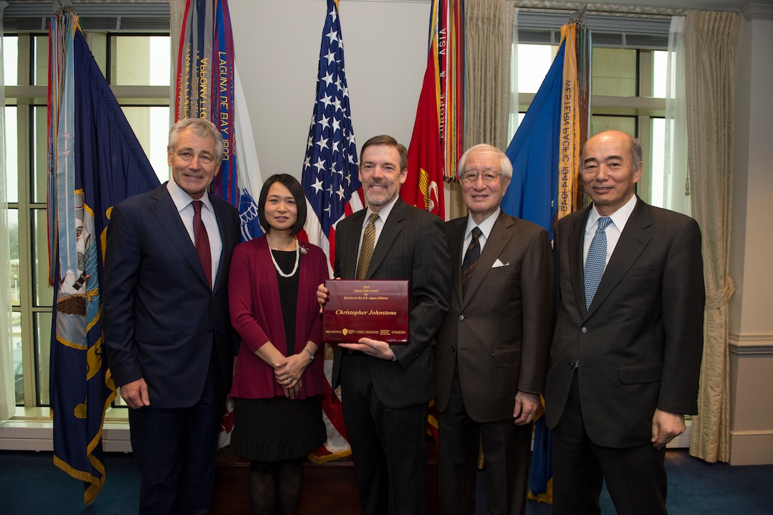 Defense Secretary Chuck Hagel, left, poses for a group photo with ...