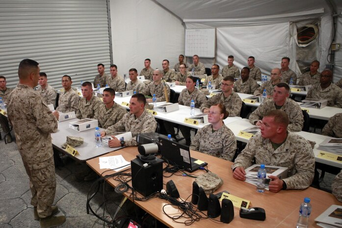 Sgt. Maj. Mario A. Marquez, the sergeant major of Command Element, Marine Forces Central Command (Forward), stands before a corporal’s course class at Shiek Isa Air Base, Bahrain, Dec. 10, 2013. Marquez talked to the class about the importance of noncommissioned officers in the Marine Corps, and how each and every one of them can impact the future of the Corps.