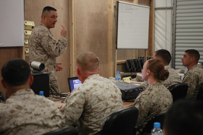 Sgt. Maj. Mario A. Marquez, the sergeant major of Command Element, Marine Forces Central Command (Forward), stands before a corporal’s course class at Shiek Isa Air Base, Bahrain, Dec. 10, 2013. Marquez talked to the class about the importance of noncommissioned officers in the Marine Corps, and how each and every one of them can impact the future of the Corps.