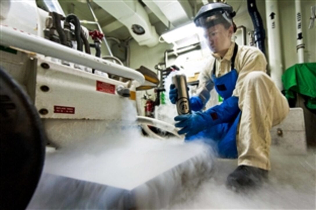 U.S. Navy Petty Officer 2nd Class Stephanie Faenza performs an odor test on liquid oxygen aboard the aircraft carrier USS Harry S. Truman in the Arabian Gulf, Jan. 12, 2014. The Harry S. Truman, flagship for the Harry S. Truman Carrier Strike Group, is deployed to the U.S. 5th Fleet area of responsibility conducting maritime security operations and supporting theater security cooperation efforts.