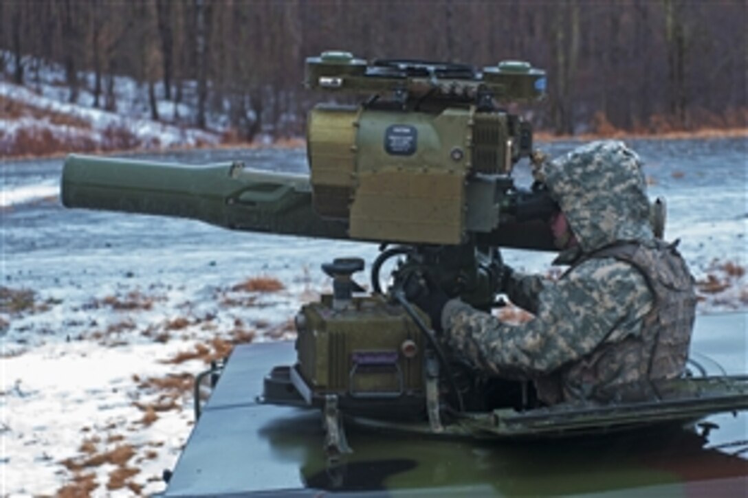 An Army National Guard soldier peers through the viewfinder of a BGM-71 TOW anti-tank missile system during a training exercise on Camp Ethan Allen Training Site, Jericho, Vt., Jan. 11, 2014. The soldier is assigned to the 3rd Battalion, 172nd Infantry Regiment, Vermont Army National Guard.