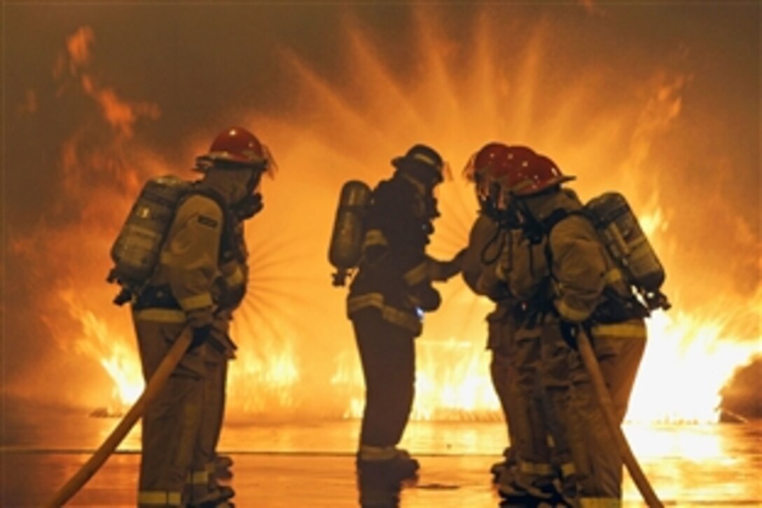 Members of Class 0814 at Officer Candidate School undergo firefighting training at the Firefighting Training School in Newport, R.I., Jan. 13, 2014. More than 1,000 candidates must complete the training each year before being commissioned into the U.S. Navy.