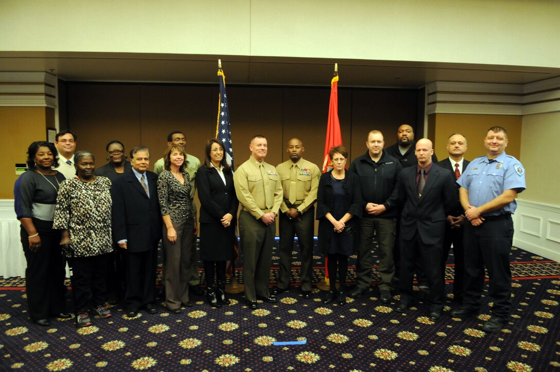 Marine Corps Base Quantico civilians were honored for the length of their federal service Jan. 8, 2014, at the Clubs at Quantico. Pictured here with Col. David Maxwell, base commander, and Sgt. Maj. Mark Byrd, base sergeant major are, from left, Tara Howard, Frank Decker, Loraine Clemons, Jacquelyn Lononwilson, Bhasker Thaker, Angela Huff, Ricky Crain, Aicha DeJesus, Charlotte Martinek, Eric Horton, Lamar Harvey, Ken Delahoussay, Patrick Daize and Christopher Payne. 