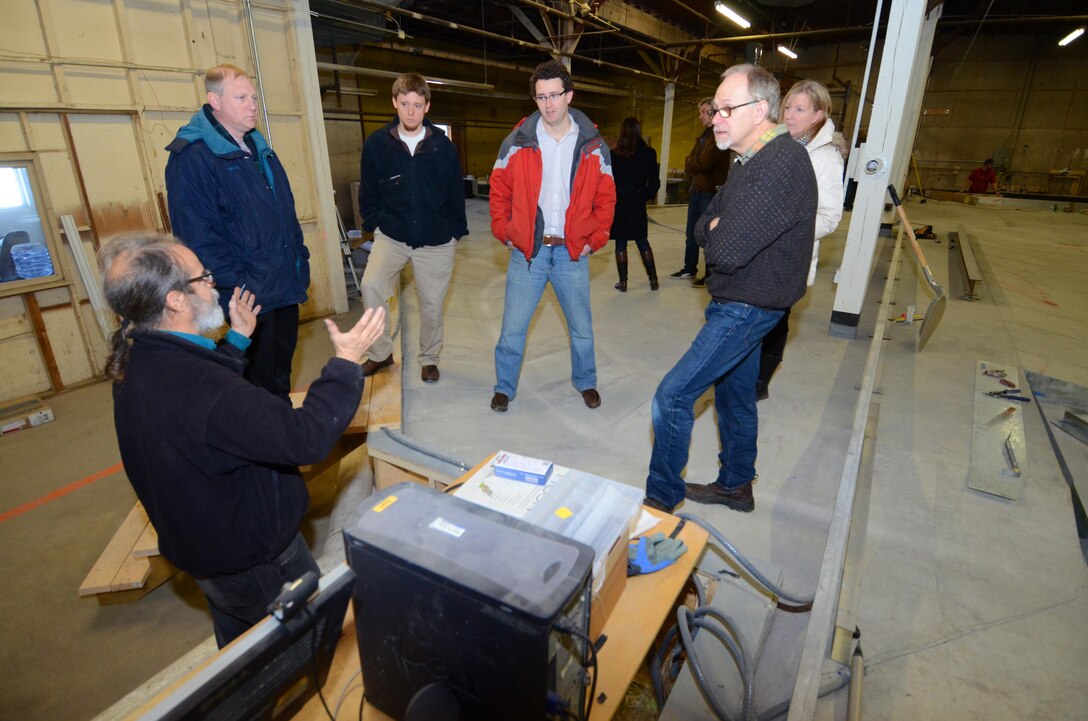 Members of the St. Paul District’s Fargo-Moorhead Metro Flood Risk Management team recently made a site visit to view a model of the Maple River aqueduct over the  proposed diversion channel. The 50:1 scale model measures 80 feet by 70 feet is being constructed at the University of Minnesota Outreach Research and Education Park in Rosemount, Minn. Here, Chris Ellis, Senior Research Associate at St. Anthony Falls Laboratory, explains to Corps employees (left to right) Craig Evans, Bob Edstrom, Aaron Snyder, Bill Csajiko and Marsha Mose, how the model will collect data that engineers can use to refine how the project is designed and constructed.