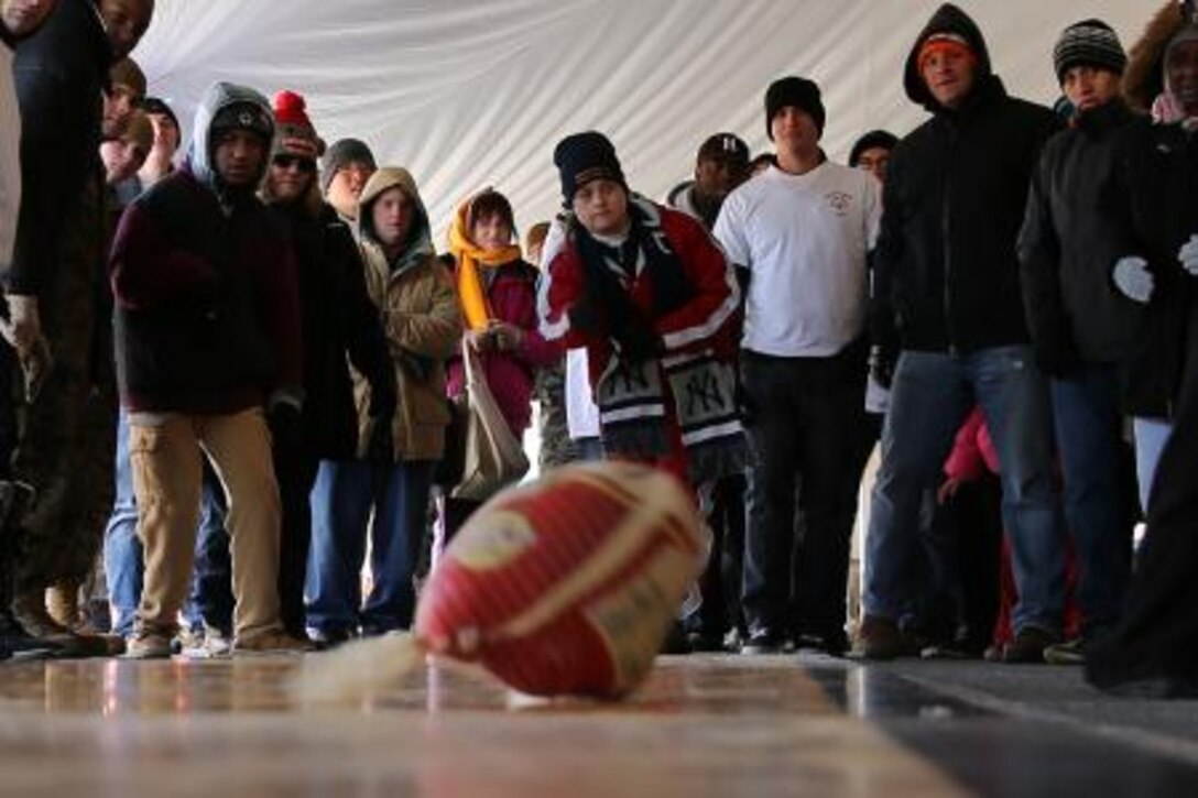 Erica Walderman, special Olympian, bowls a turkey during the Cherry Point Special Olympics at the commissary Jan 7. Walderman competed in several events including the turkey bowl, junk in the trunk and dizzy mummies.


