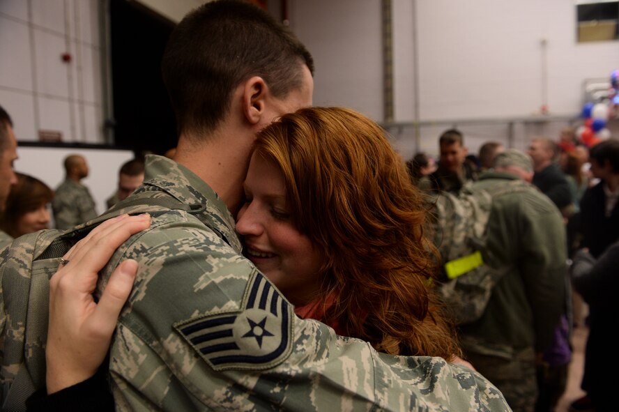 SPANGDAHLEM AIR BASE, Germany – Melissa Bigler is reunited with her husband U.S. Air Force Staff Sgt. Tyler Bigler, 606th Air Control Squadron, after a deployment to Southwest Asia Jan. 15, 2014. The 606th ACS supported the entire Afghanistan area of responsibility by providing the 251,000-square mile area with persistent long range radar, data links and radio communication capability at a greater than 99 percent mission effective rate during their deployment. (U.S. Air Force photo by Senior Airman Rusty Frank/Released)